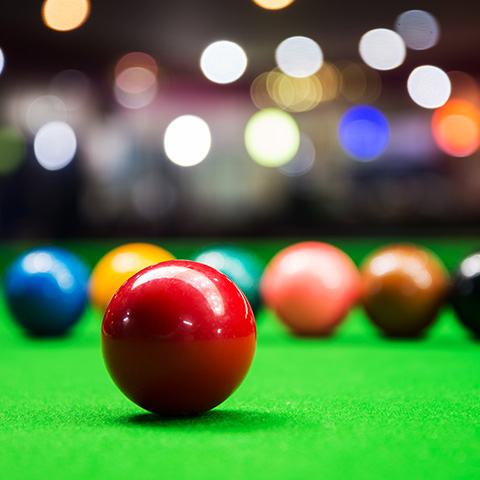 snooker balls sat on a snooker table