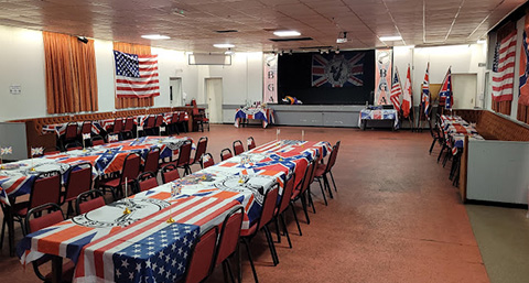 a concert hall with patriotic table cloths in Bilston Sports and Social Club