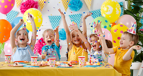 a group of children celebrating at a birthday party